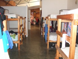 This is where I live! We have a bed, 2 shelves and a clothes railing each. There are 12 sets of bunks in the girls dorm and 10 in the guys